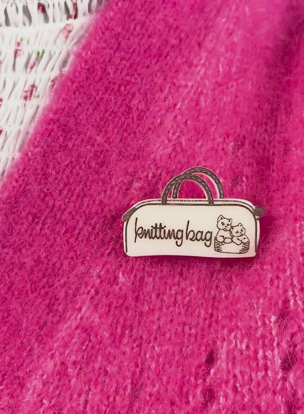 Video of our Knitting Bag Brooch worn on a pink fluffy cardigan