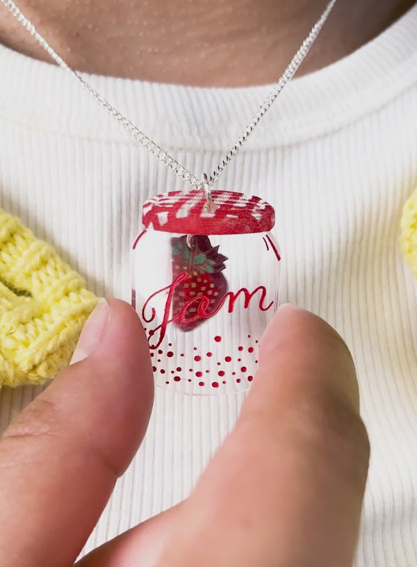 Video of our Jam Jar Pendant Necklace showing the Strawberry wiggling inside