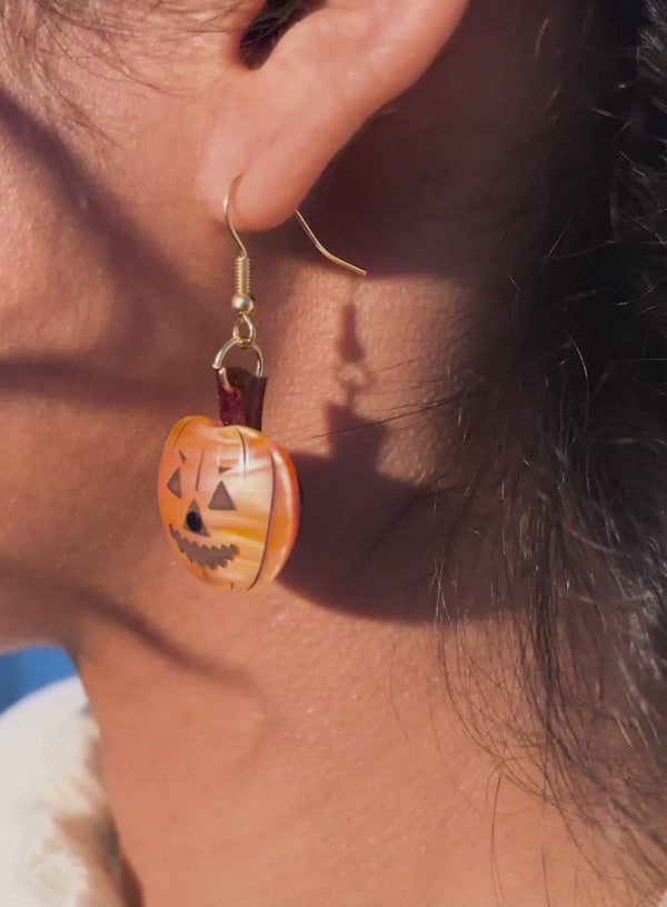 Video of Pumpkin Earrings handmade from curved pearly orange acrylic