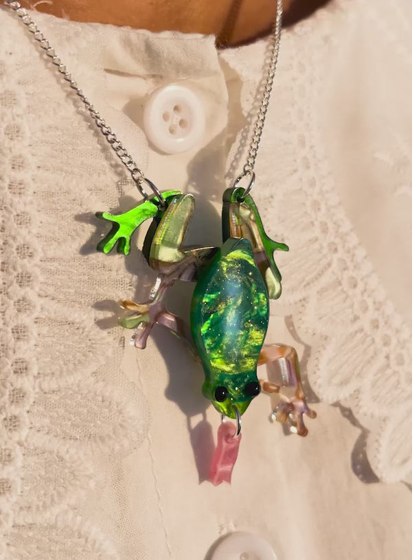 Video of the Pearly Frog Necklace handmade from green glitter flecked acrylic with a pink tongue